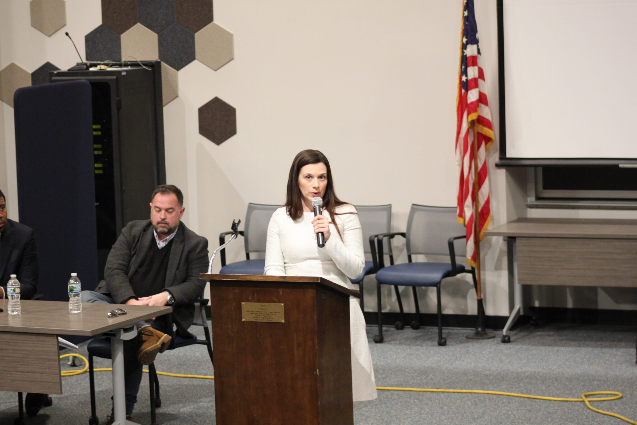 Luke Britt and Marisa Kwiatkowski speak at the Lake County Government Center in March 2025